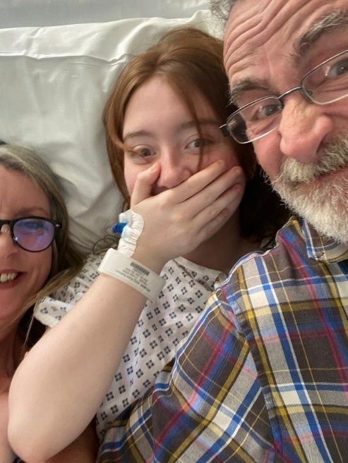 Naomi, Molly and Nigel pictured in hospital.