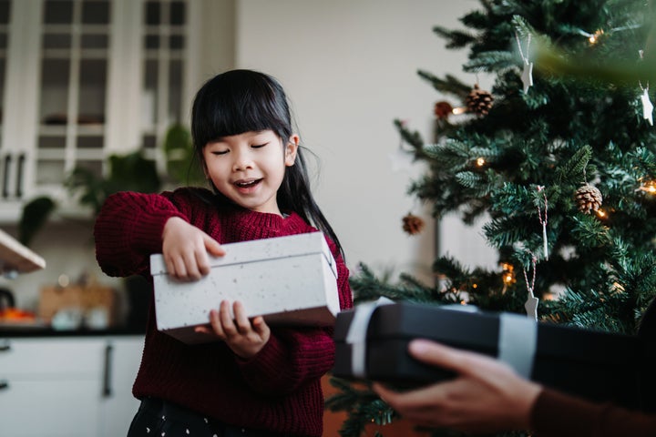 This Christmas, There's More To Argos' with Connie and Trevor showing off  their favourite toys