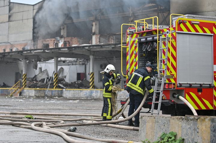 State Emergency Service personnel respond to a Russian drone strike on industrial warehouses in Lviv, in western Ukraine on Tuesday.
