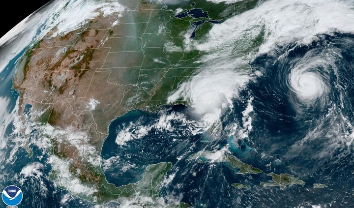 In an Aug. 30 satellite image provided by the National Oceanic and Atmospheric Administration, Hurricane Idalia is shown over Florida and crossing into Georgia while Hurricane Franklin, to the right, moves along off the East Coast.
