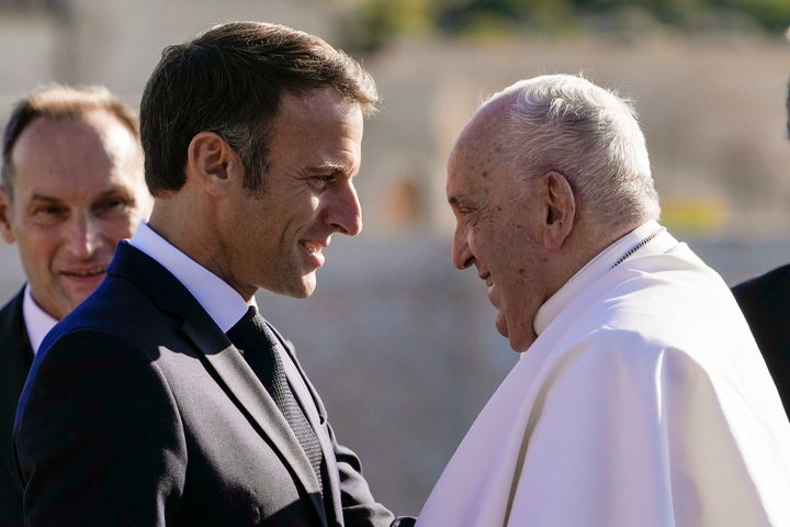 Pope Francis is welcomed by French President Emmanuel Macron as arrives at the final session of the "Rencontres Mediterraneennes" meeting at the Palais du Pharo, in Marseille, France, Saturday, Sept. 23, 2023.