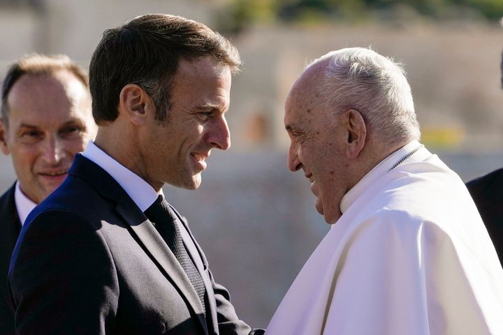 Pope Francis is welcomed by French President Emmanuel Macron as arrives at the final session of the "Rencontres Mediterraneennes" meeting at the Palais du Pharo, in Marseille, France, Saturday, Sept. 23, 2023.