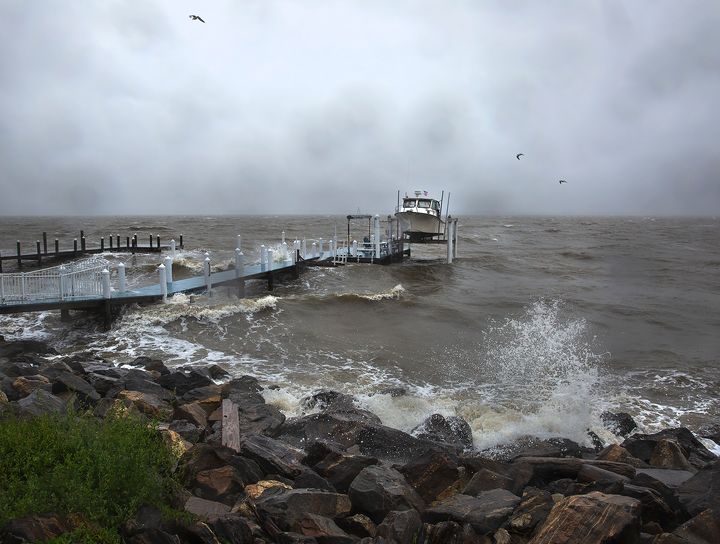 Waves generated by Tropical Storm Ophelia crash up on the banks of the Potomac River along Irving Avenue in the town of Colonial Beach in Westmoreland County, Va., on Saturday, Sept. 23, 2023. (Peter Cihelka/The Free Lance-Star via AP)