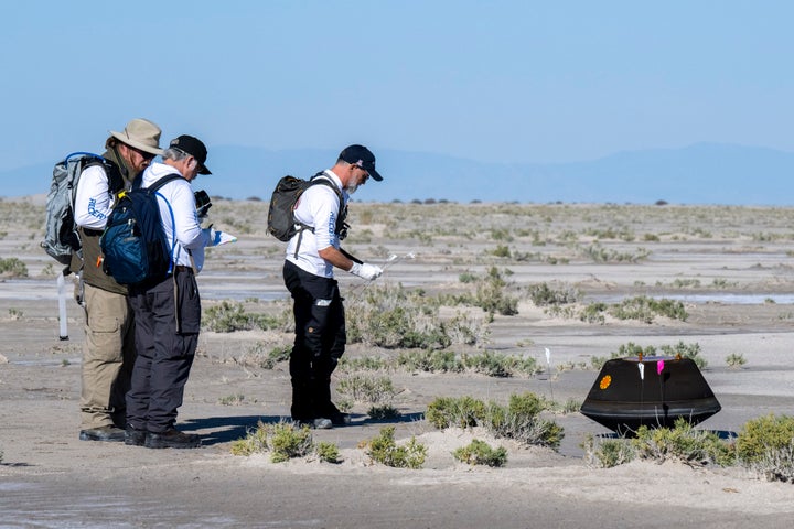 NASA Astromaterials Curator Francis McCubbin, NASA Sample Return Capsule Science Lead Scott Sandford, and University of Arizona OSIRIS-REx Principal Investigator Dante Lauretta collect science data shortly after the sample return capsule from NASA's OSIRIS-REx mission landed at the Department of Defense's Utah Test and Training Range, on September 24, 2023 in Dugway, Utah. The sample was collected from the asteroid Bennu in October 2020 by NASA's OSIRIS-REx spacecraft.