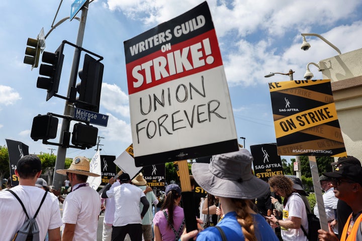 Striking WGA members picket with striking SAG-AFTRA members outside Paramount Studios on Sept. 18 in Los Angeles.