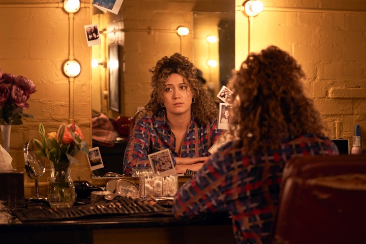 Jessie waits for Tom backstage at a play he's starring in.