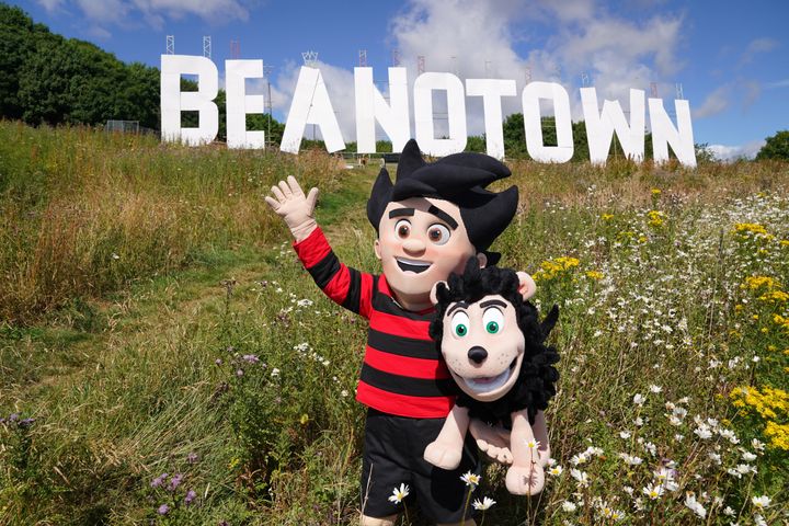 Dennis the Menace stands in front of a giant sign erected at Dundee Law renaming the city of Dundee to Beanotown to mark the start of the Dundee Bash Street Festival last year.