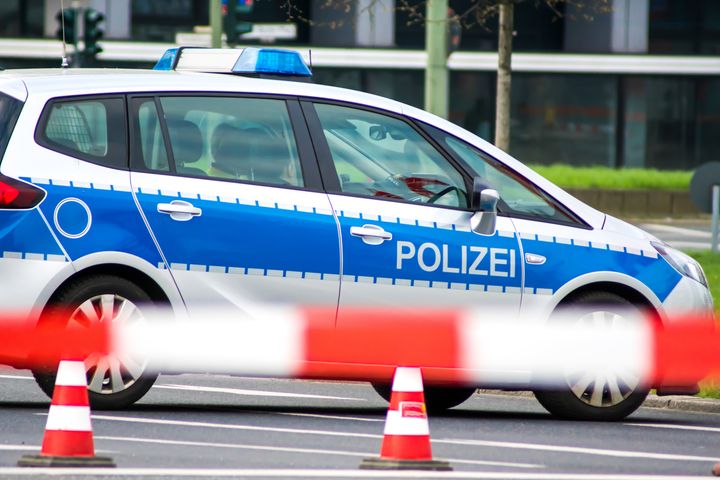 Close up of police car behind barrier tape, Berlin Charlottenburg Ernst-Reuter-Platz