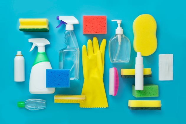 Various disinfection cleaning products, alcohol spray, sanitiser on blue background.