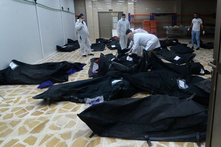 Bodies of people killed in the fire are seen in an event hall in Qaraqosh, also known as Hamdaniyah, on Wednesday.