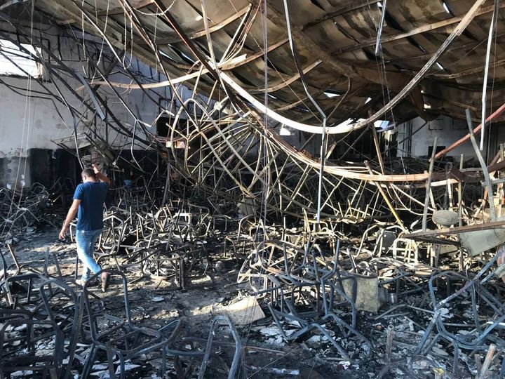 A destroyed building in the northern Nineveh province in Mosul, Iraq, is pictured Wednesday following a blaze that is believed to have killed at least 100 people.
