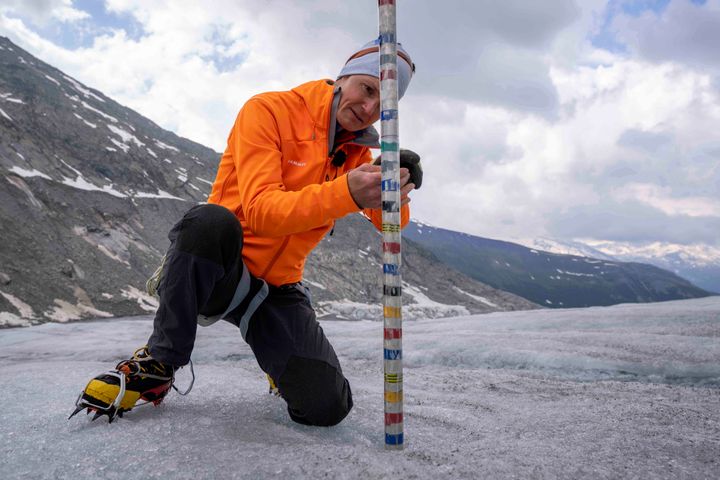 Swiss Federal Institute of Technology glaciologist and head of the Swiss measurement network Glamos, Matthias Huss, checks the thickness of the Rhone Glacier near Goms, Switzerland, in June 2023.