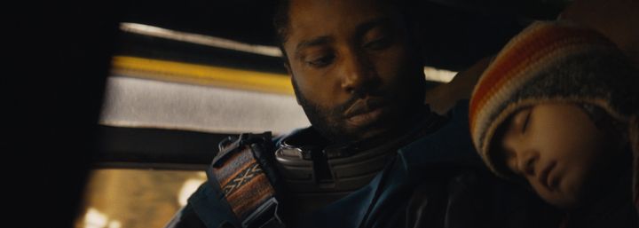 John David Washington (left) and Madeleine Yuna Voyles try to make a case for an amicable existence with AI in "The Creator."