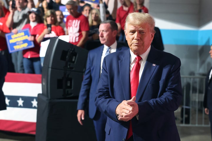 Former President Donald Trump arrives for a campaign stop at Drake Enterprises, an automotive parts manufacturer, on Wednesday.