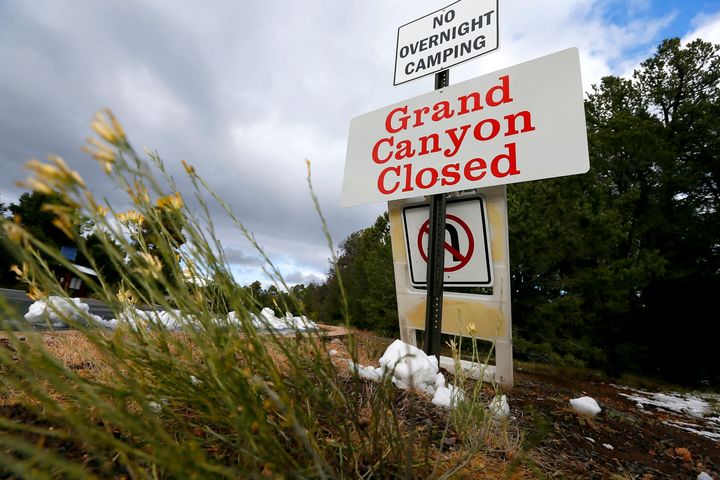FILE - The main entrance to Grand Canyon National Park remains closed to visitors in Grand Canyon, Ariz., due to the government shutdown, in October 2013. Arizona Gov. Katie Hobbs and Utah Gov. Spencer Cox say that the iconic parks they look to keep open amid a possible shutdown are important destinations and local communities depend on dollars from visitors. (AP Photo/Ross D. Franklin, File)