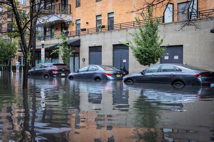 Cars sit parked in deep water as heavy rains cause streets to flood in Hoboken, N.J., on Friday, Sept. 29, 2023.