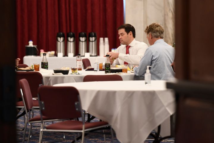 Sen. Rand Paul (R-Ky.), right, and Sen. Marco Rubio (R-Fla.), left, have lunch at a Republican policy lunch on Capitol Hill in March 2020.