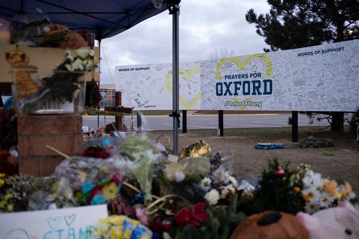 A memorial is pictured outside of Oxford High School alongside a board where people can share their words of support following the 2021 shooting.