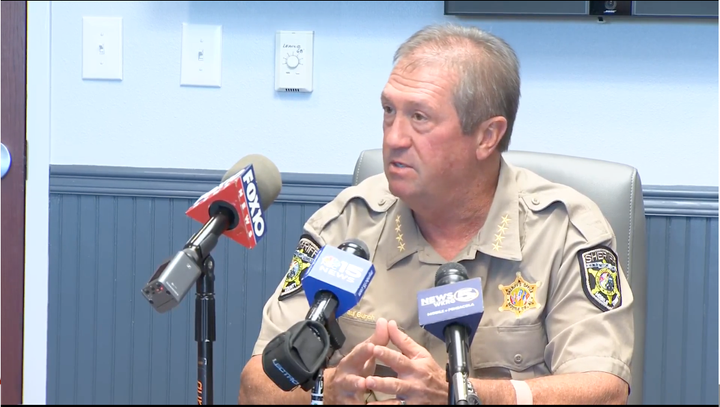 Mobile County Sheriff Paul Burch speaks to reporters on Friday about the deaths of a 37-year-old woman and her two young children.