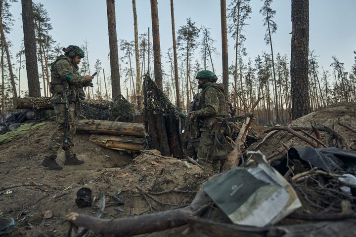 Ukrainian soldiers inspect the captured Russian positions during combat manoeuvres in the Kreminna Forest near Kreminna, Luhansk region.