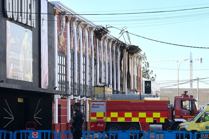 Emergency services cordon off a street where at least thirteen people were killed in a fire at a nightclub in Murcia, Spain.