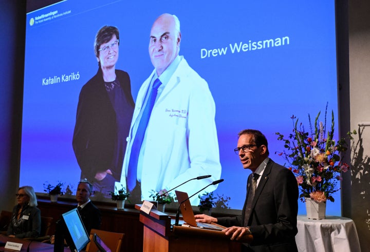 Member of Nobel Assembly at the Karolinska Institute Thomas Perlmann speaks in front of a picture of this year's laureates to the media during the announcement of the winners of the 2023 Nobel Prize in Physiology or Medicine at the Karolinska Institute in Stockholm on Oct. 2, 2023. 