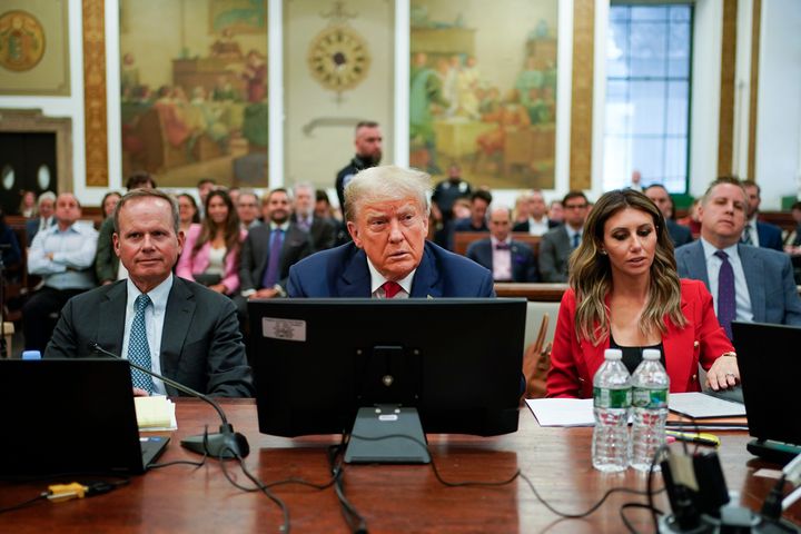 Former President Donald Trump, center, sits in the courtroom with is legal team before the continuation of his civil business fraud trial at New York Supreme Court, on Oct. 3, 2023, in New York.
