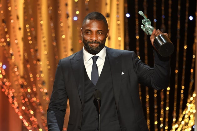 Elba accepts the Male Actor in a Supporting Role award for 