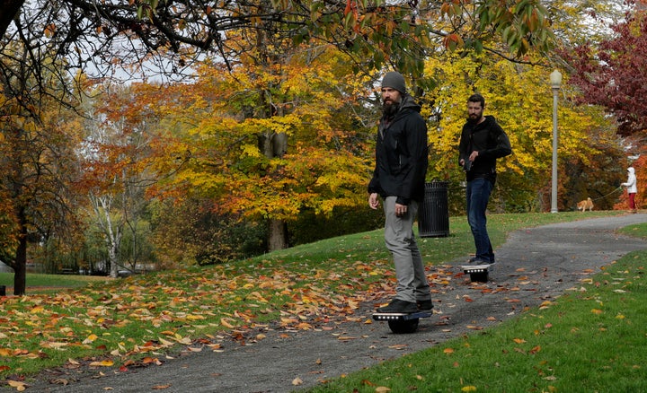 Two people ride Onewheels through Wright Park in Tacoma, Wash., on Oct. 26, 2018.