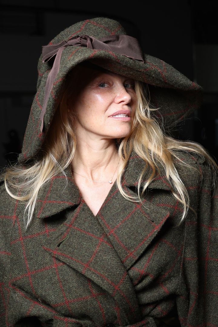 Pamela Anderson photographed at the Vivienne Westwood Womenswear Spring/Summer 2024 during Paris Fashion Week.