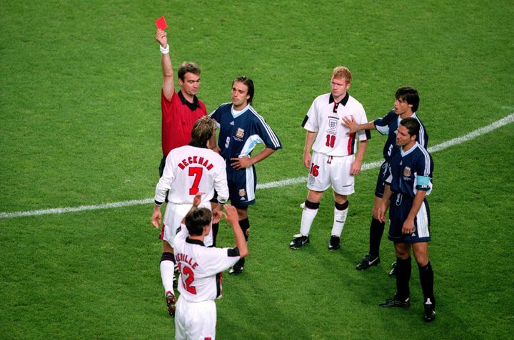 Referee Kim Milton Nielsen shows David Beckham of England a red card at the 1998 World Cup