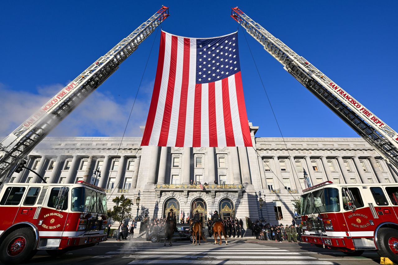 Fire trucks hang the American flag in honor of Feinstein, who smashed gender barriers and overcame stalwart opposition from the American intelligence community to publish a bombshell report on the CIA's post-9/11 torture practices.