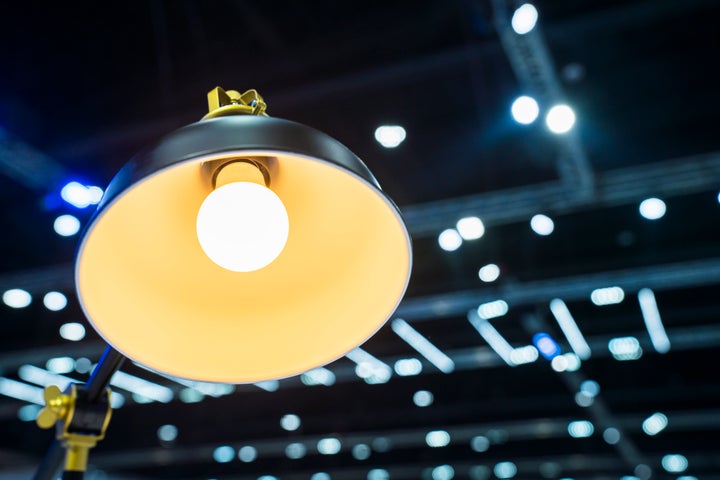 Close up photo of a modern, copper lamp with bulb