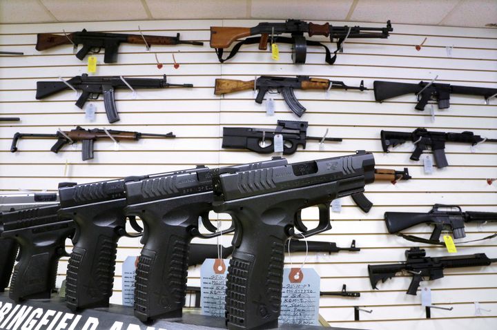 Semi-automatic rifles and and hand guns are seen for sale at Capitol City Arms Supply on Jan. 16, 2013, in Springfield, Illinois.