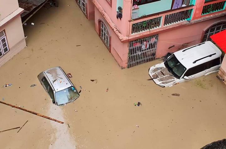 Cars lie submerged in water after flash floods triggered by a sudden heavy rainfall swamped the Rangpo town in Sikkim, India, on Oct. 5, 2023.