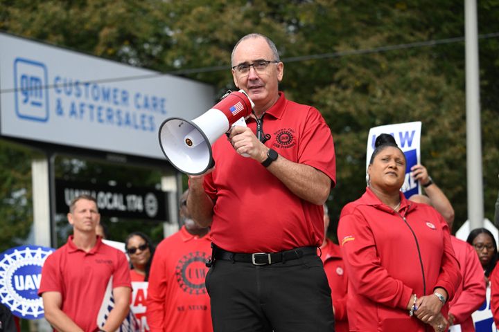 UAW President Shawn Fain, shown here on the picket line, said General Motors has offered to put battery plant workers under the union's contract.