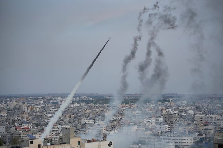 Rockets are launched by Palestinian militants from the Gaza Strip towards Israel, in Gaza, Saturday, Oct. 7, 2023. The militant Hamas rulers of the Gaza Strip carried out an unprecedented, multi-front attack on Israel at daybreak Saturday, firing thousands of rockets as dozens of Hamas fighters infiltrated the heavily fortified border in several locations by air, land, and sea and catching the country off-guard on a major holiday. (AP Photo/Hatem Moussa)