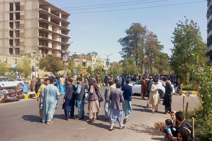 People gather on the streets in Herat on October 7, 2023. A magnitude 6.3 earthquake hit western Afghanistan October 7 morning, the United States Geological Survey said, followed by four large aftershocks with epicentres close to the region's largest city. (Photo by AFP via Getty Images) 