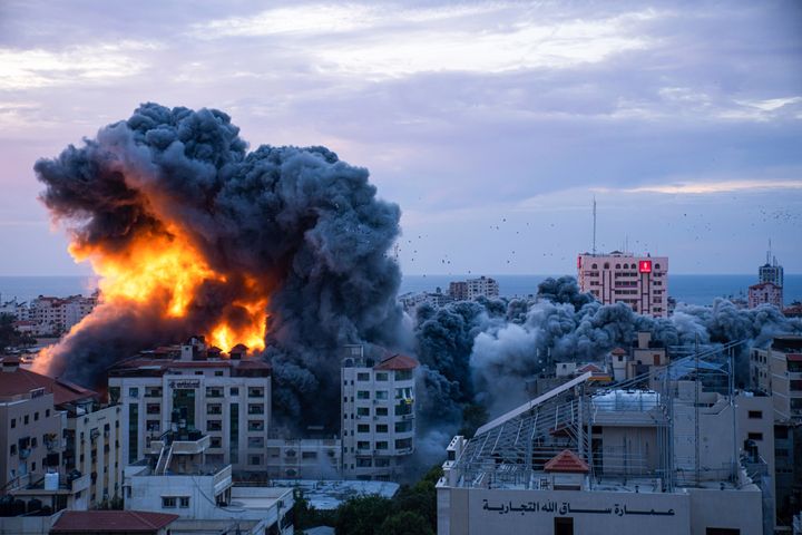 Fire and smoke rises following an Israeli airstrike in Gaza City on Saturday after militant Hamas rulers of the Gaza Strip overwhelmed the heavily fortified Israeli border. 