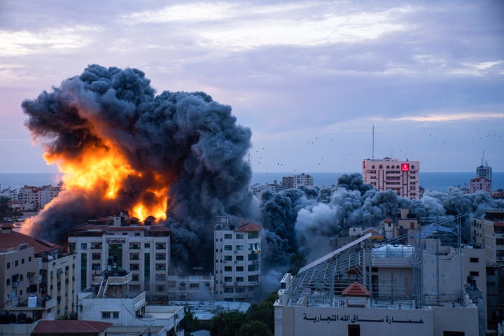 Fire and smoke rises following an Israeli airstrike, in Gaza City, Saturday, Oct. 7, 2023. The militant Hamas rulers of the Gaza Strip carried out an unprecedented, multi-front attack on Israel at daybreak Saturday, firing thousands of rockets as dozens of Hamas fighters infiltrated the heavily fortified border in several locations by air, land, and sea, killing dozens and stunning the country. Palestinian health officials reported scores of deaths from Israeli airstrikes in Gaza. (AP Photo/Fatima Shbair)