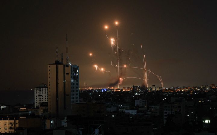 An Israeli missile launched from the Iron Dome defense missile system attempts to intercept a rocket, fired from the Gaza Strip, over the city of Netivot in southern Israel on October 8, 2023. Israel, reeling from the deadliest attack on its territory in half a century, formally declared war on Hamas Sunday as the conflict's death toll surged past 1,000 after the Palestinian militant group launched a massive surprise assault from Gaza.