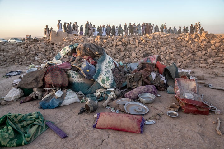 Afghan men search for victims after an earthquake in Zenda Jan district in Herat province, of western Afghanistan, on Oct. 8, 2023. Powerful earthquakes killed at least 2,000 people in western Afghanistan, a Taliban government spokesman said Sunday. It's one of the deadliest earthquakes to strike the country in two decades.