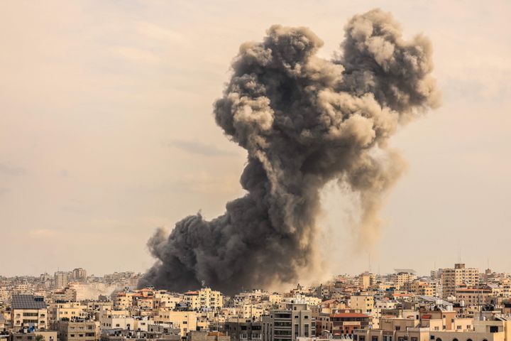 A plume of smoke rises in the sky of Gaza City during an Israeli airstrike on October 9, 2023.