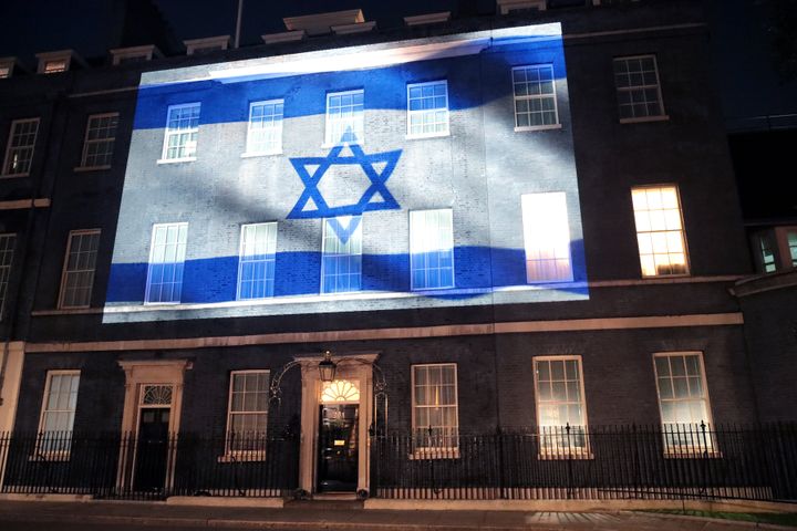Israel's flag is projected onto the front of 10 Downing Street in a show of support after Hamas began rocket and ground attacks on Israel.