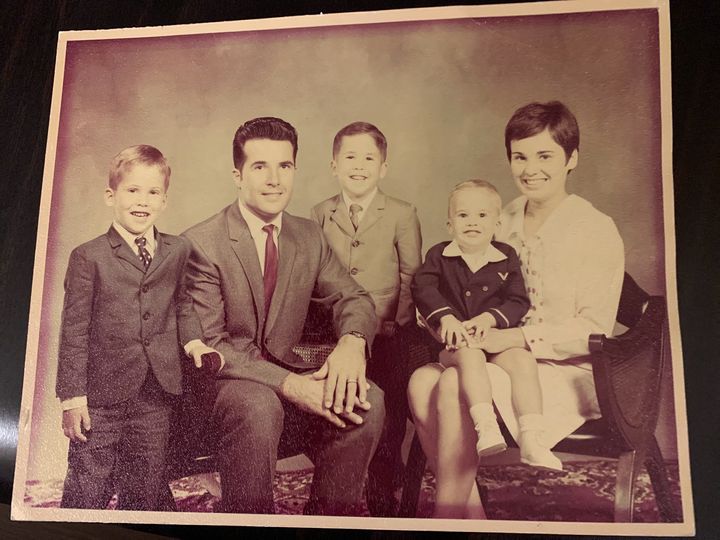 The author on his mother's lap, posing for a family photo.