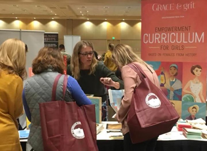 The author explaining her company's curriculum to conference attendees in Colorado.