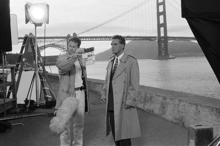 "Unsolved Mysteries" host and narrator Robert Stack films a scene in San Francisco.