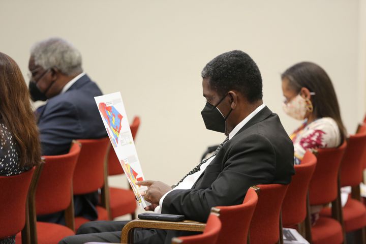 Then-South Carolina state Rep. Jerry Govan looks over a map during a House redistricting committee public hearing in 2021. That map is now being challenged at the Supreme Court.