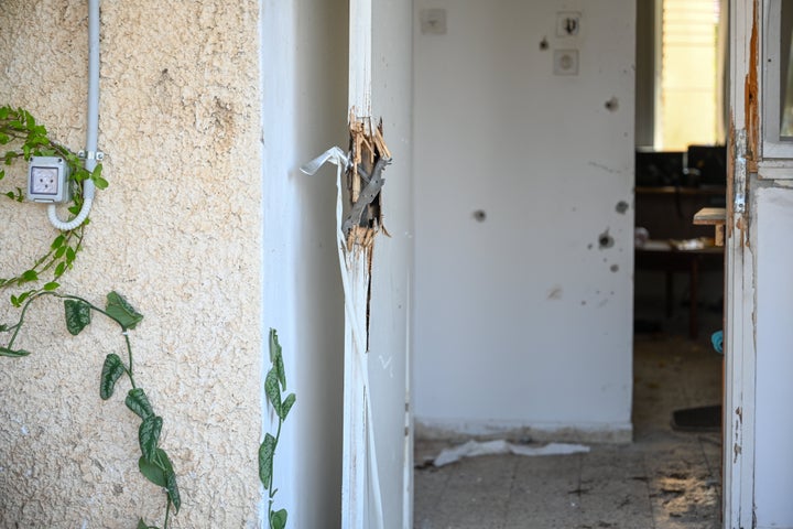 KFAR AZA, ISRAEL - OCTOBER 10: Bullet holes are seen on the wallls of a house next to a broken door handle where days earlier an attack by Hamas militants took place on this kibbutz near the border with Gaza, on October 10, 2023 in Kfar Aza, Israel. Israel has sealed off Gaza and conducted airstrikes on Palestinian territory after an attack by Hamas killed hundreds and took more than 100 hostages. On October 7, the Palestinian militant group Hamas launched a surprise attack on Israel from Gaza by land, sea, and air, killing over 700 people and wounding more than 2000. Israeli soldiers and civilians have also been taken hostage by Hamas and moved into Gaza. The attack prompted a declaration of war by Israeli Prime Minister Benjamin Netanyahu, and ongoing retaliatory strikes by Israel on Gaza killing hundreds.(Photo by Alexi J. Rosenfeld/Getty Images)