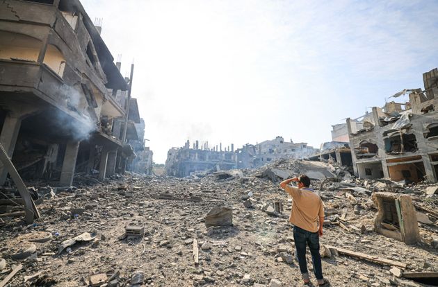 A man looks at the destruction in a ravaged neighbourhood in the Gaza Strip Jabalia refugee camp on October 11, 2023